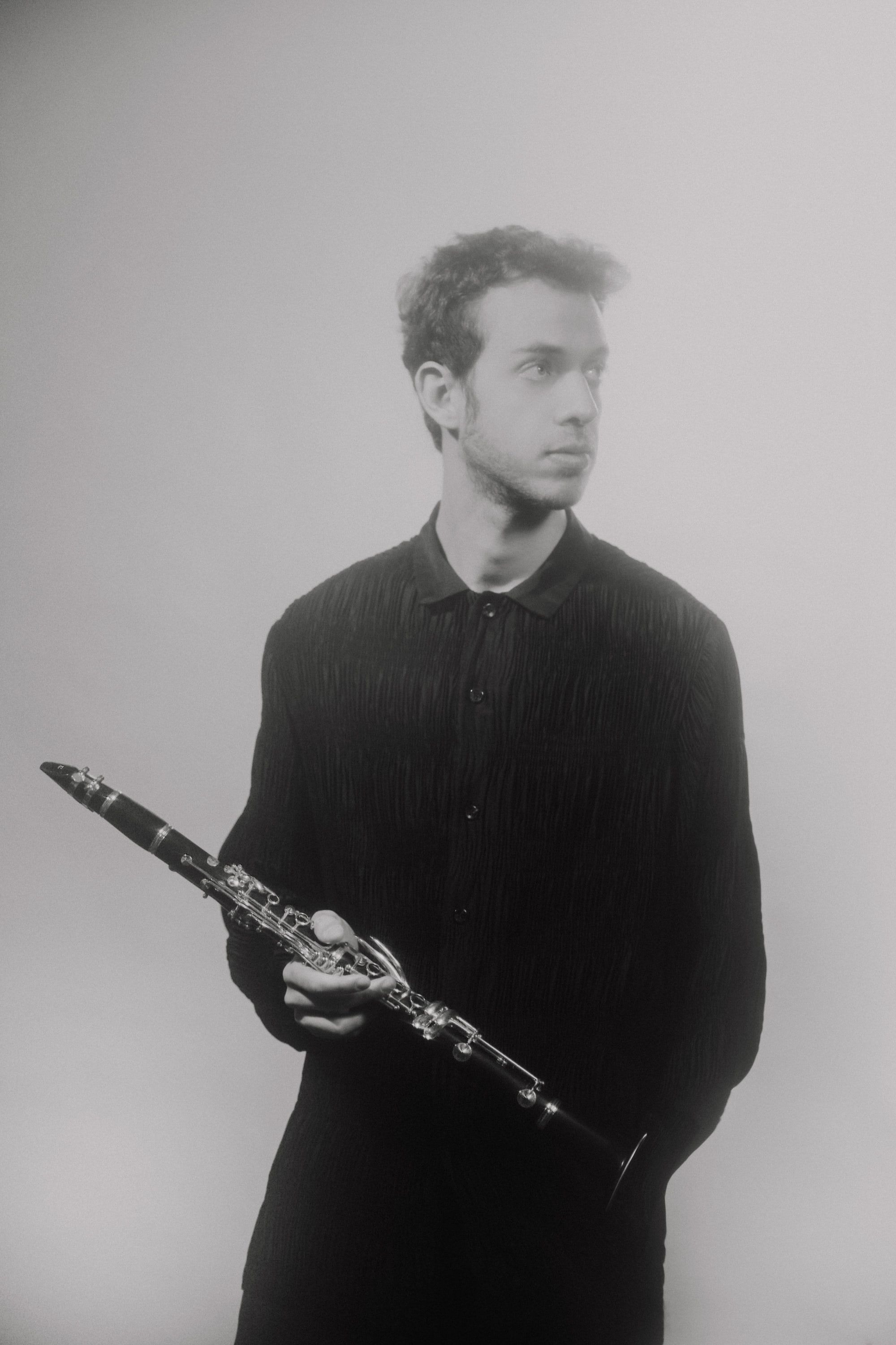 Jonathan Leibovitz in pale grey haze, clarinet held low
